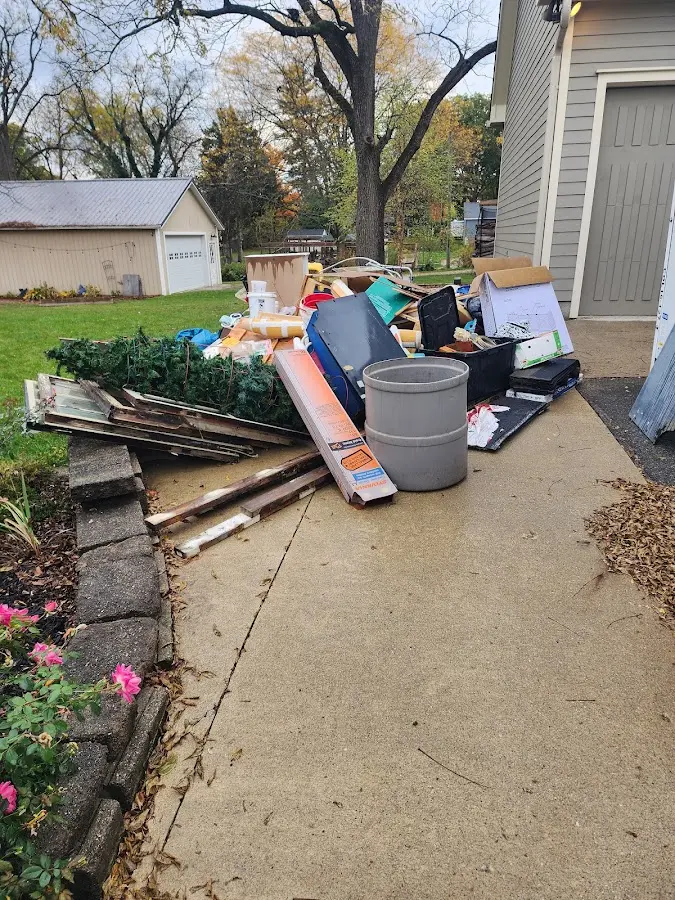 Dumpster being loaded with debris for Roofing Dumpster Rental in Wappingers Falls